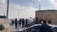 Security vehicles and police personnel deployed in Jordan's Karak governorate