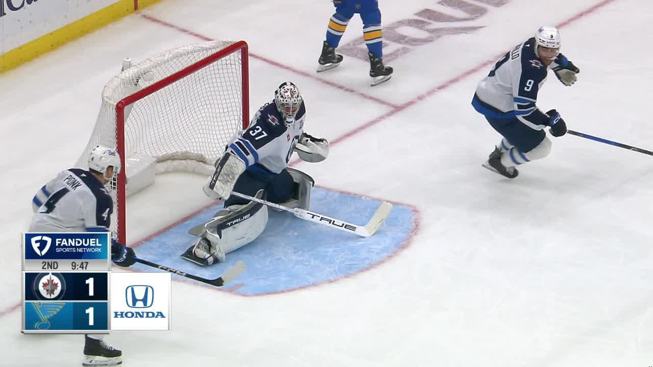 Winnipeg Jets goaltender Connor Hellebuyck focused on the ice during an NHL game