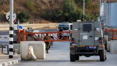 Israeli military vehicles at a West Bank checkpoint as soldiers enforce a closure ahead of the October 2026 Knesset election