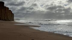 Dark storm clouds gathering over a landscape in northern Britain ahead of severe weather