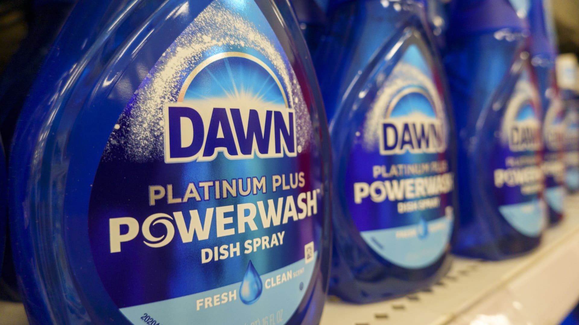 Shelves stocked with Procter and Gamble household cleaning and laundry care products.