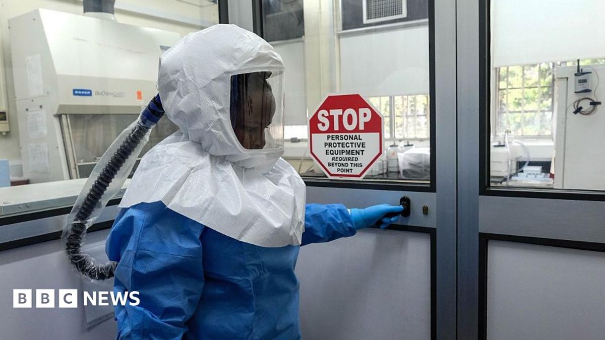 Medical personnel and health authorities at an isolation and treatment facility.