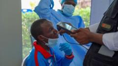 Medical workers in protective suits responding to an Ebola outbreak in the Democratic Republic of Congo