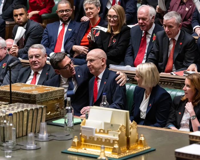 Chancellor John Healey holds the red budget box outside 11 Downing Street ahead of his 2026 budget statement