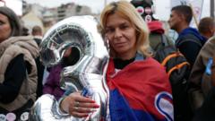 Demonstrators gather during an anti-corruption protest in Serbia holding banners advocating for institutional accountability.