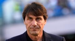 Italian football manager Antonio Conte looking focused on the touchline during a match.
