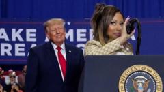 Nicki Minaj joins Donald Trump onstage at a campaign rally in Michigan