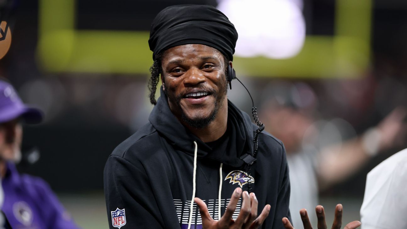 Baltimore Ravens quarterback Lamar Jackson looks on during a team practice session.