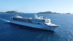 The Villa Vie Odyssey cruise ship docked in Cambodian waters as passengers disembark following suspension of the vessel's round-the-world voyage
