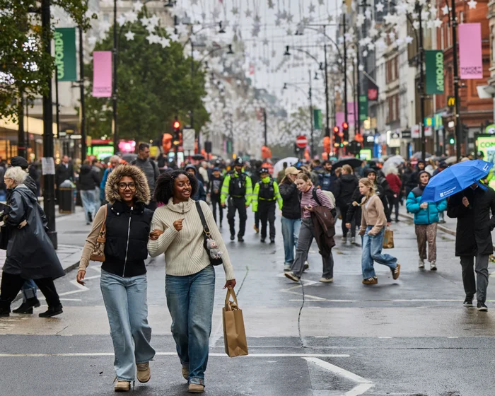 Pedestrians walking through the traffic-free section of Oxford Street in London