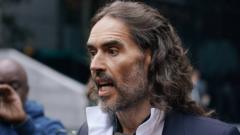 Russell Brand arrives at Southwark Crown Court in London for his trial.