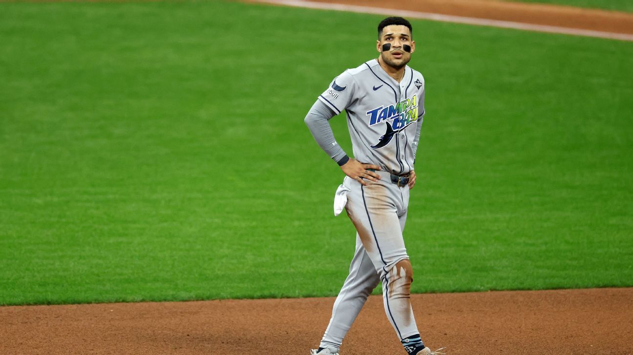 A Tampa Bay Rays runner sliding toward a base during a World Series matchup against the Milwaukee Brewers.