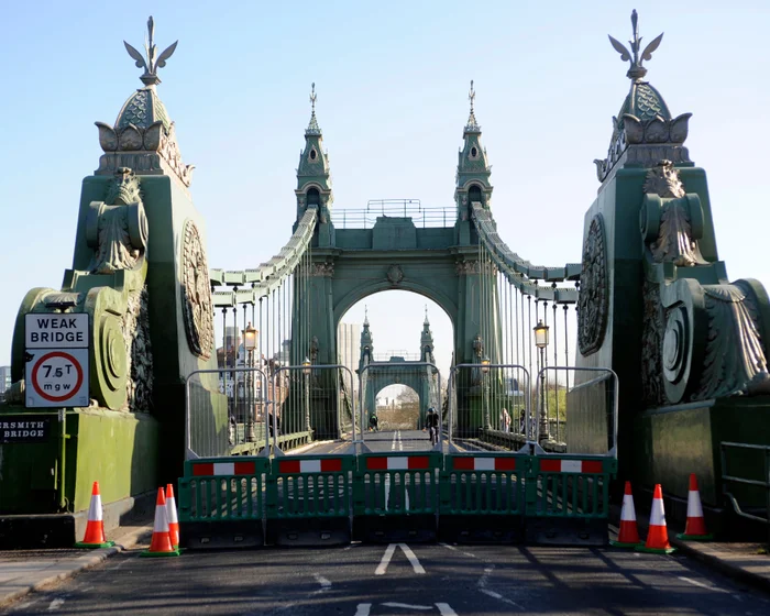 Hammersmith Bridge spanning the River Thames with barricades blocking motor traffic