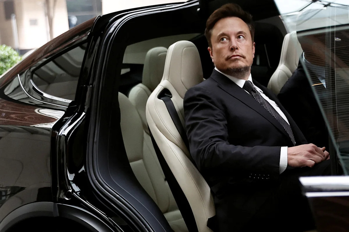 Tesla, Meta and IBM branding accompanying coverage of AI investment and earnings calls