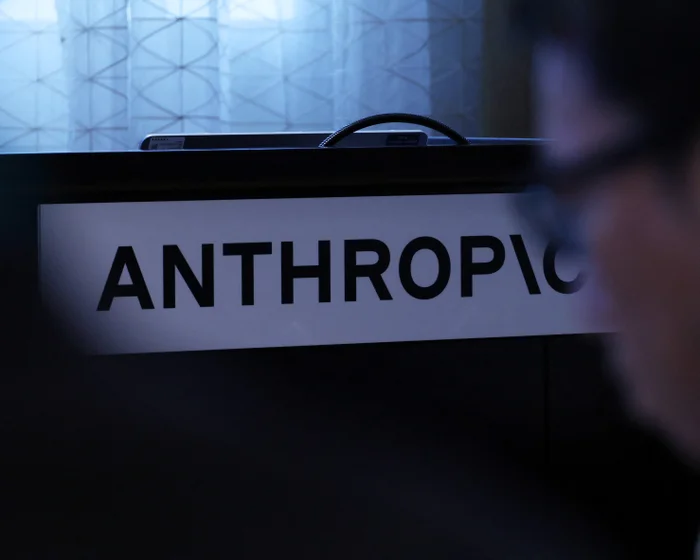 Anthropic logo displayed on a desk sign
