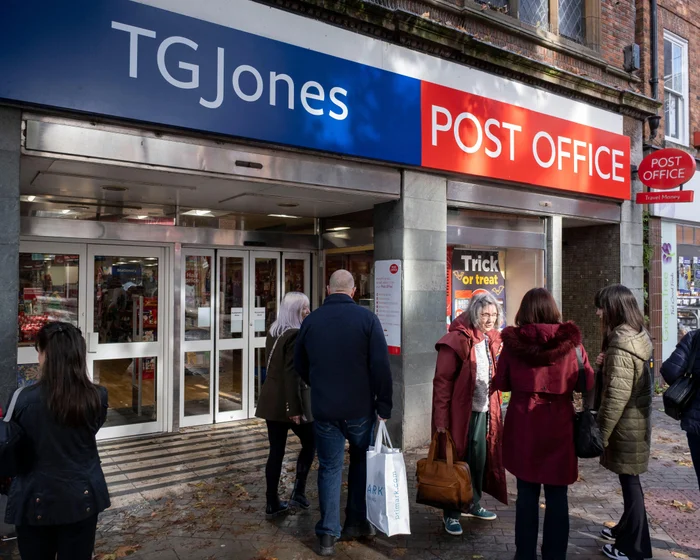A Post Office counter operating inside a high street retail store.