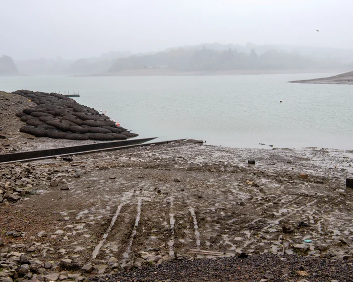 Dry, cracked shoreline exposed by low water levels at Ardingly Reservoir in Sussex